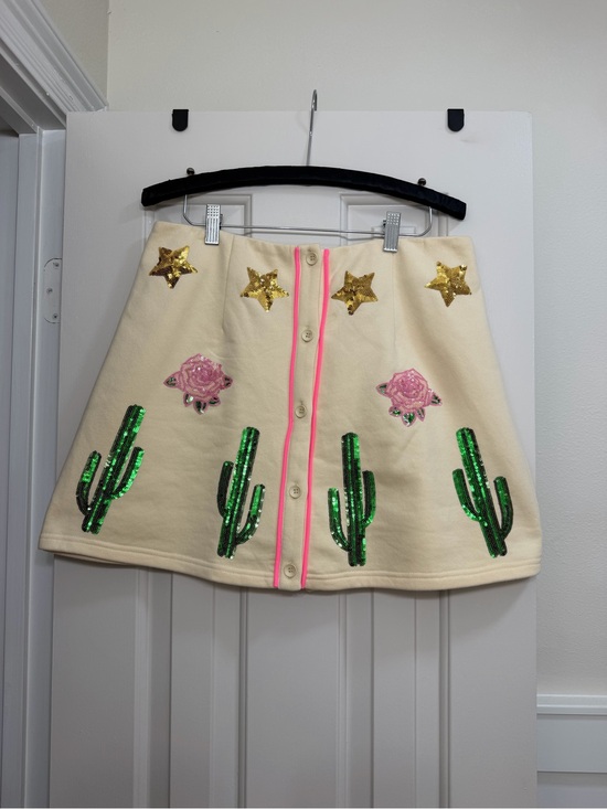QUEEN OF SPARKLES Dresses & Skirts - QUEEN OF SPARKLES Cream Mini Skirt with Green Sequin Cacti & Gold Stars